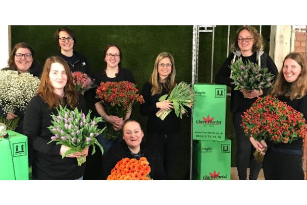 People holding flowers and boxes