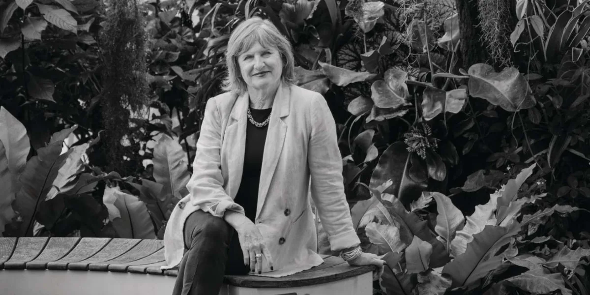 Charlotte Rowe garden designer Woman sat in garden