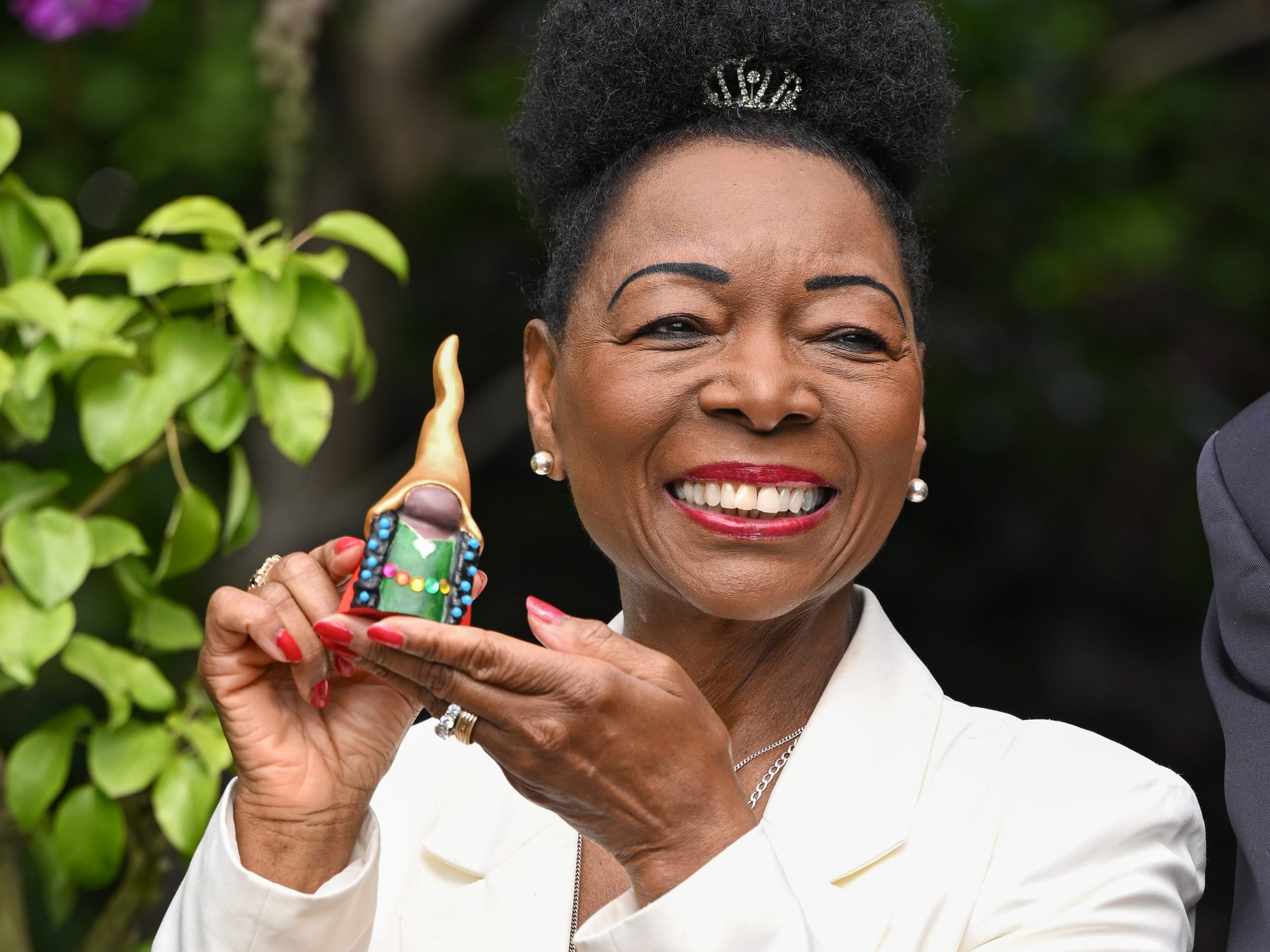 Baroness Dame Floella Benjamin poses with her painted gnome to be auctioned as she attends the RHS Chelsea Flower Show 2026©&nbsp;Jeff Spicer/Getty Images