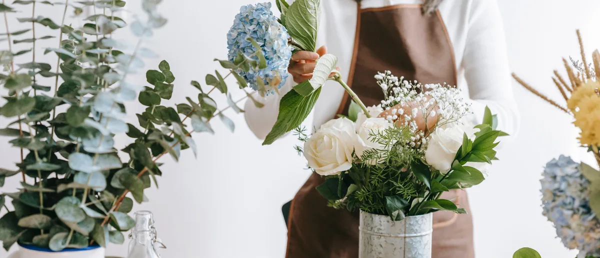 Floristry courses Woman making floral display