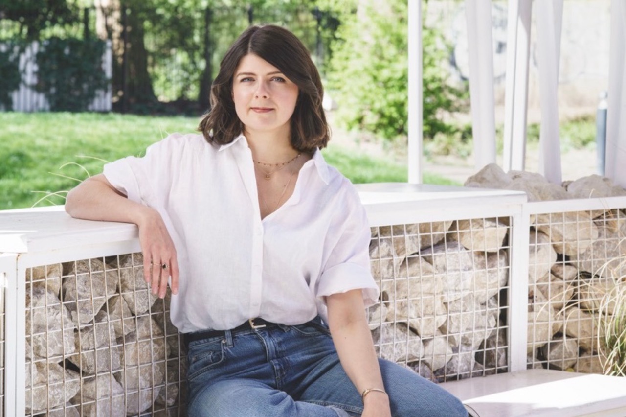 Woman sat in garden room