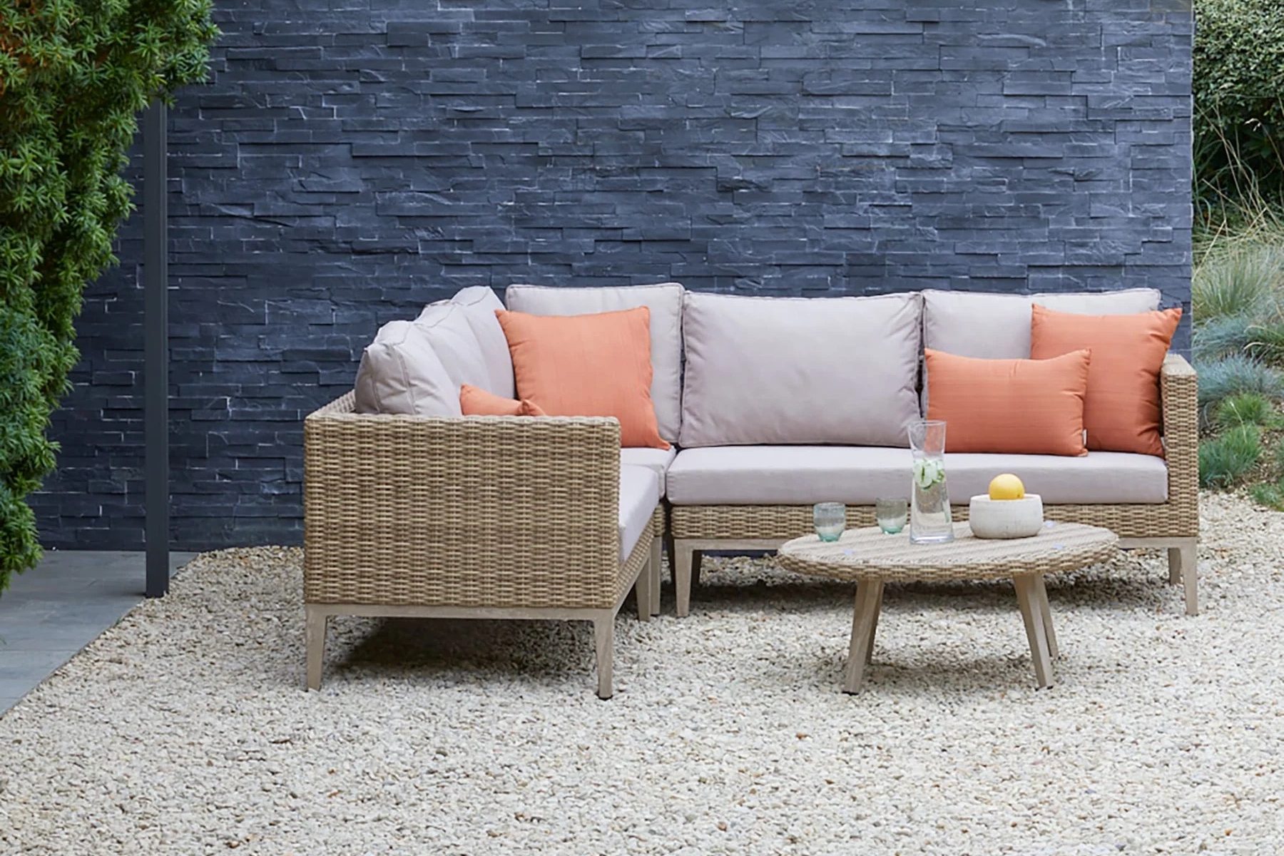Gardenesque Lyndhurst Corner Garden Furniture Set on a gravel patio