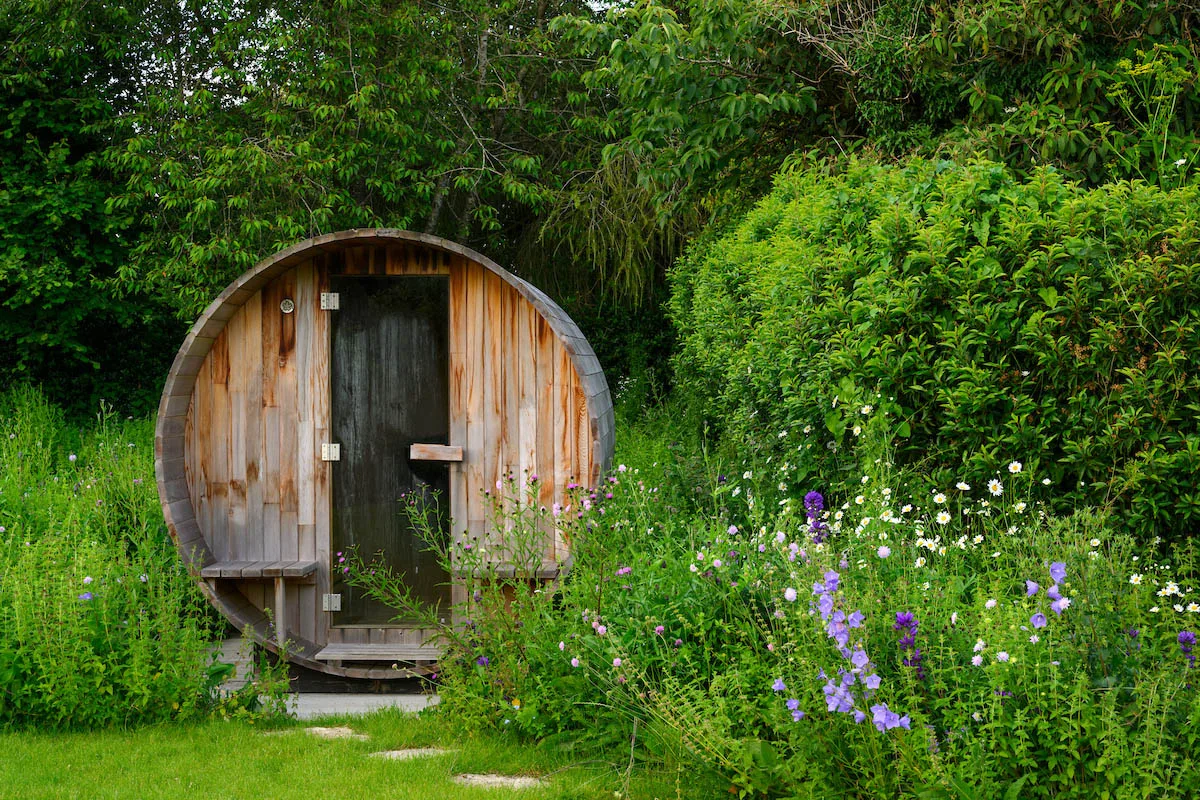 A sauna from Barrel Saunas UK in a garden designed by Emily Crowley-Wroe A sauna from Barrel Saunas UK in a garden designed by Emily Crowley-Wroe