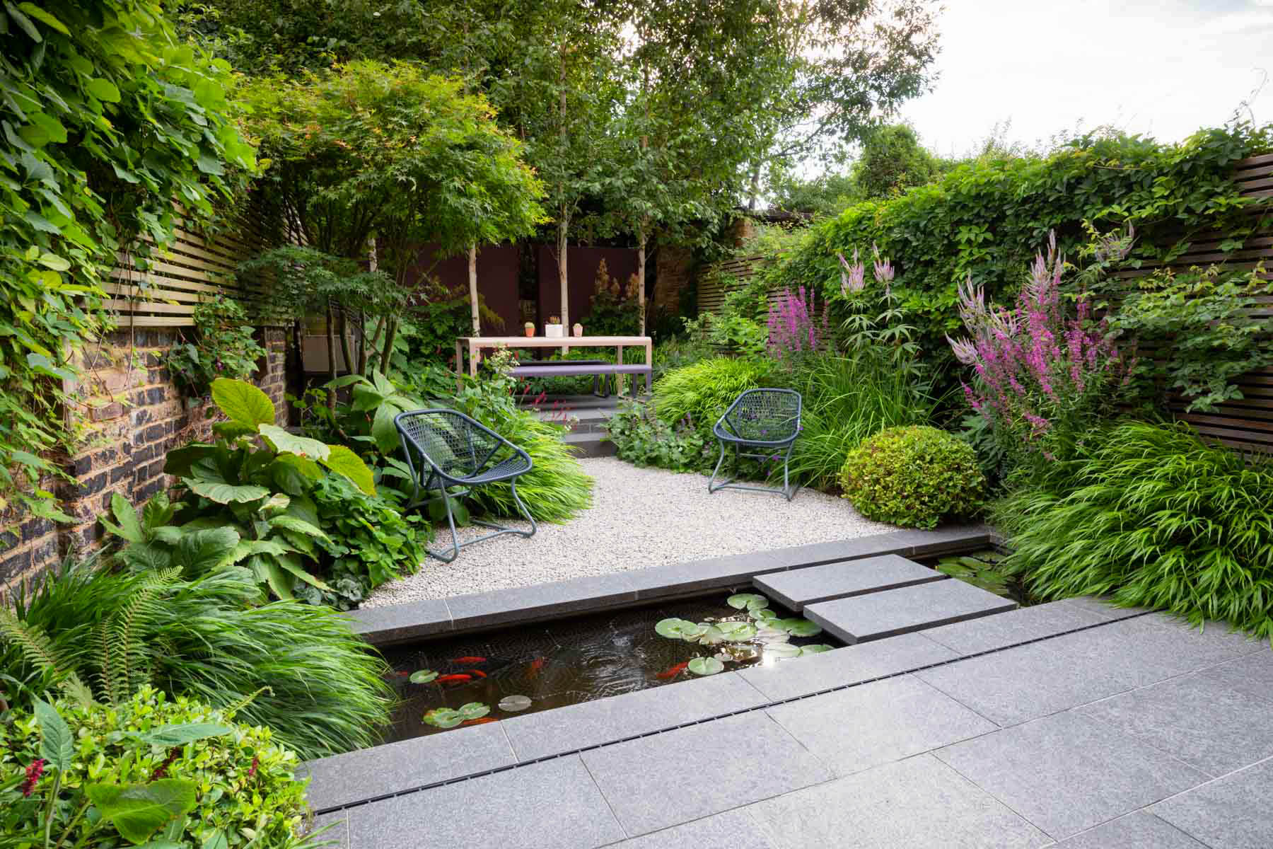 Small garden with pond and seating